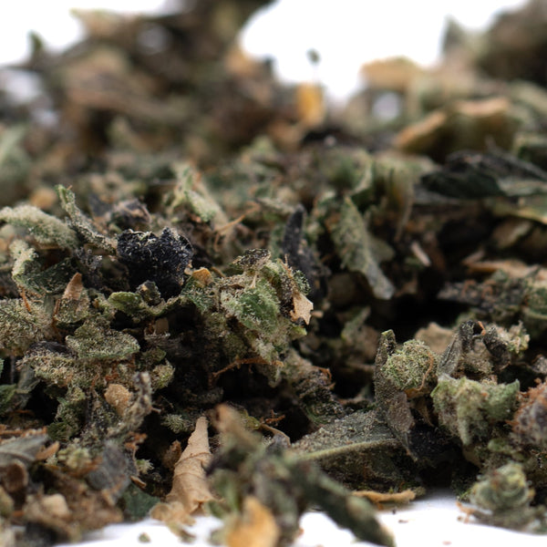 Pile of dried herbs from Butter OG’s Indoor Trim, ideal for THCA trim use