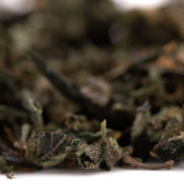 Loose dark green tea leaves from Guava Tartz THCA trim hemp flower product